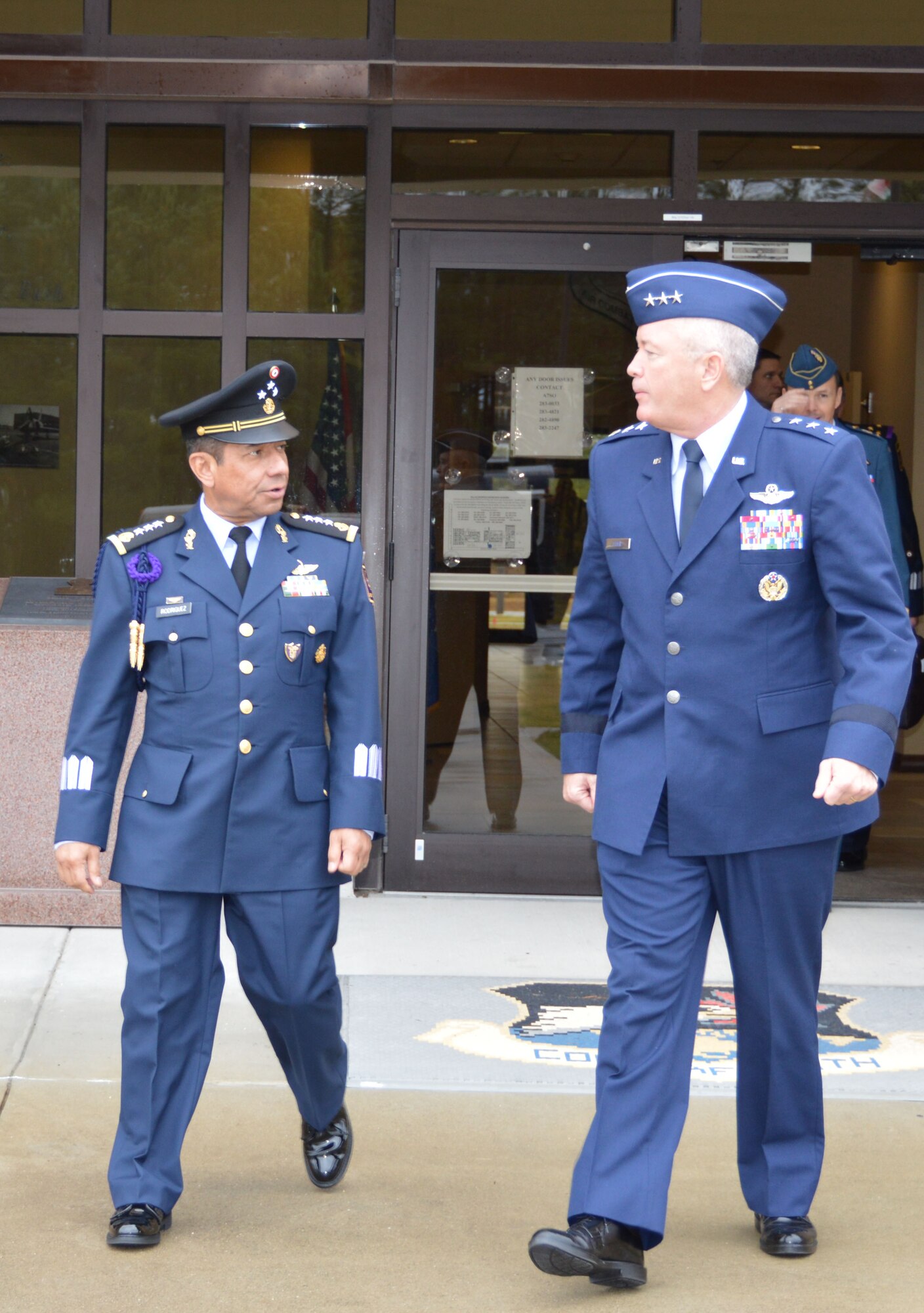 Lt. Gen.  Carlos Antonio Rodriguez Munguia, Commander, Mexican Air Force departs the Killey Center for Homeland Operations with Lt. Gen. William Etter, Commander, Continental U.S. Aerospace Defense Region – 1st Air Force  (Air Forces Northern) on the way to a tour of the 601st Air Operations Center. The Mexican Air Force commander, along with a group of senior U.S. and Mexican military officials, joined AFNORTH senior leaders for a visit and mission familiarization Nov. 24-26. (Photo by Mary McHale)
