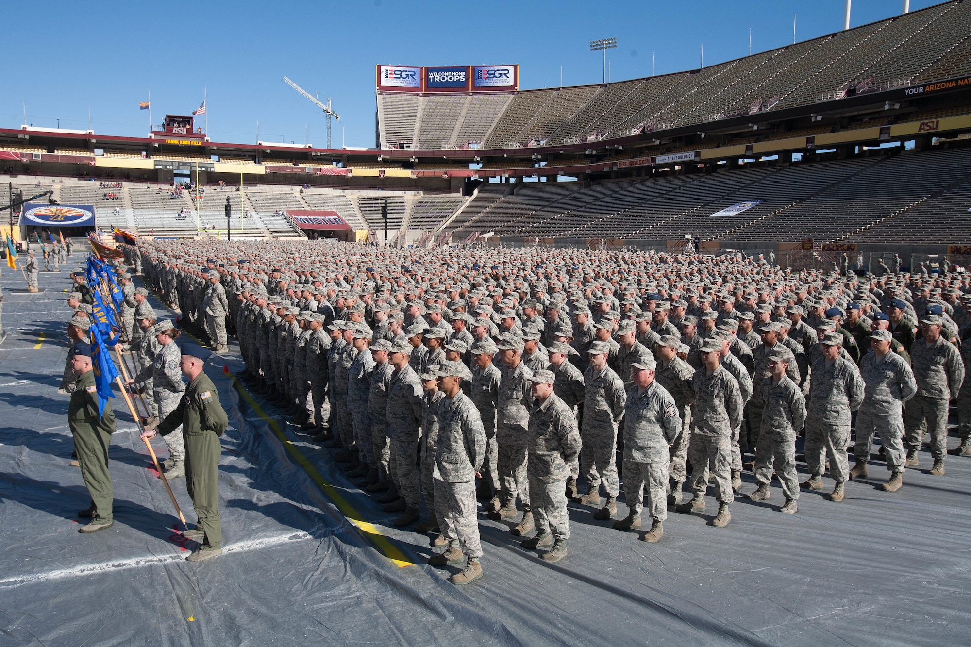 Arizona National Guard Soldiers from the 158th Maneuver Enhancement Brigade stand in formation on the field at Arizona State University’s Sun Devil Stadium, Dec. 7, 2014 in Tempe, Ariz. The formation, which was part of the Arizona National Guard Muster and Community Expo, was the first time in over a century Arizona Soldiers and Airmen assembled together in mass formation. (U.S. Army National Guard photo by Staff Sgt. Brian A. Barbour)