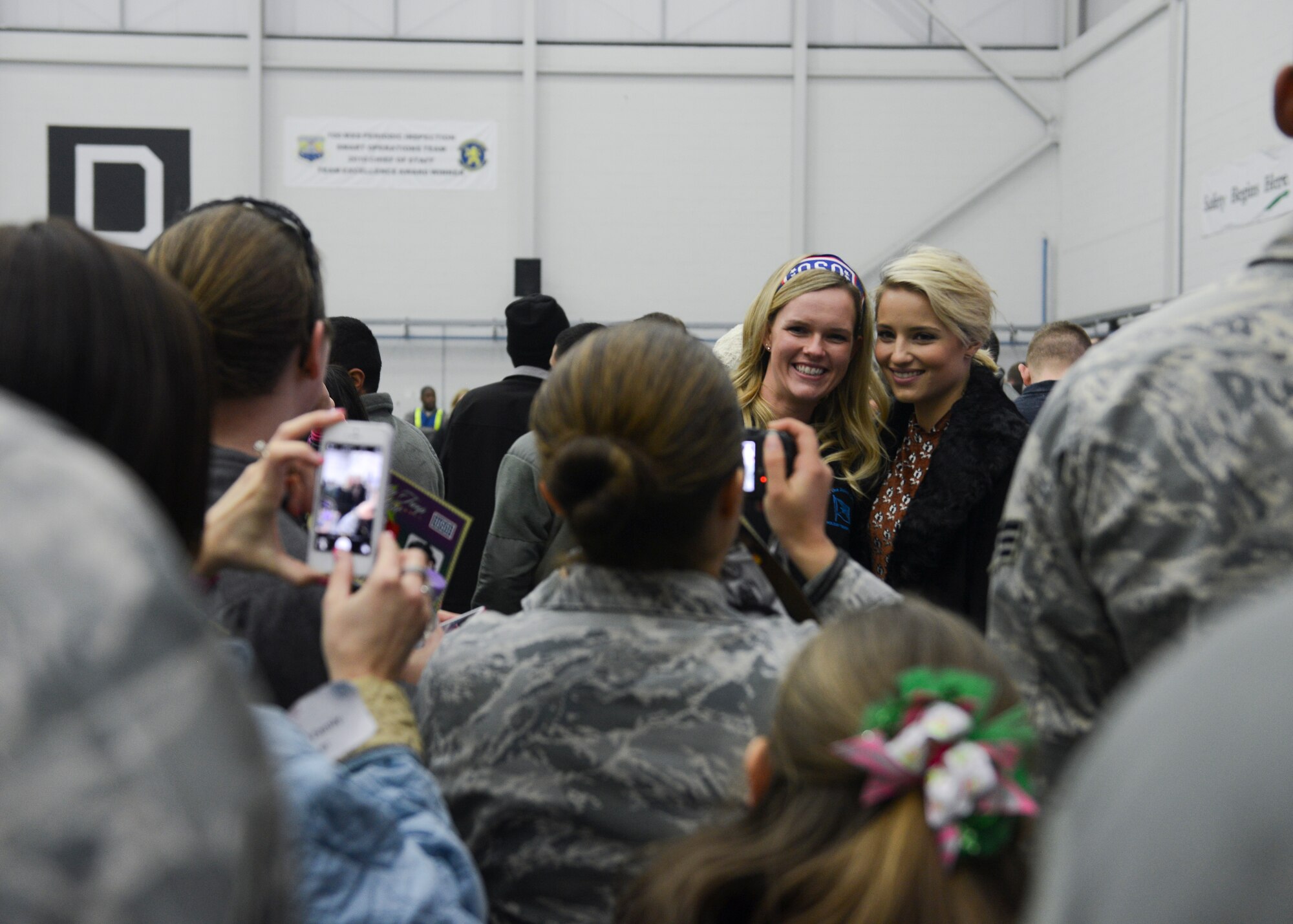 Family members of deployed Airmen participate in a Hearts Apart event during the USO holiday tour Dec. 10, 2014, on RAF Mildenhall, England. The USO tour featured singers, actors and sports icons who visited service members overseas during the holiday season. (U.S. Air Force photo by Senior Airman Victoria H. Taylor/Released)