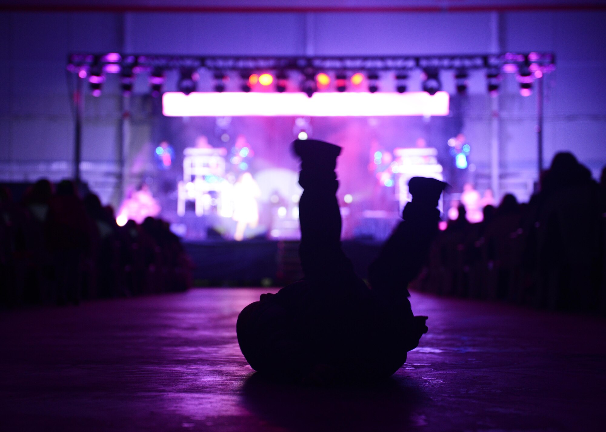 A child dances during a Tops in Blue performance, Dec. 9, 2014, at Aviano Air Base, Italy. This year, TIB toured to more than 50 military installations in more than 10 countries to provide entertainment to service members and their families. (U.S. Air Force photo/Airman 1st Class Deana Heitzman)