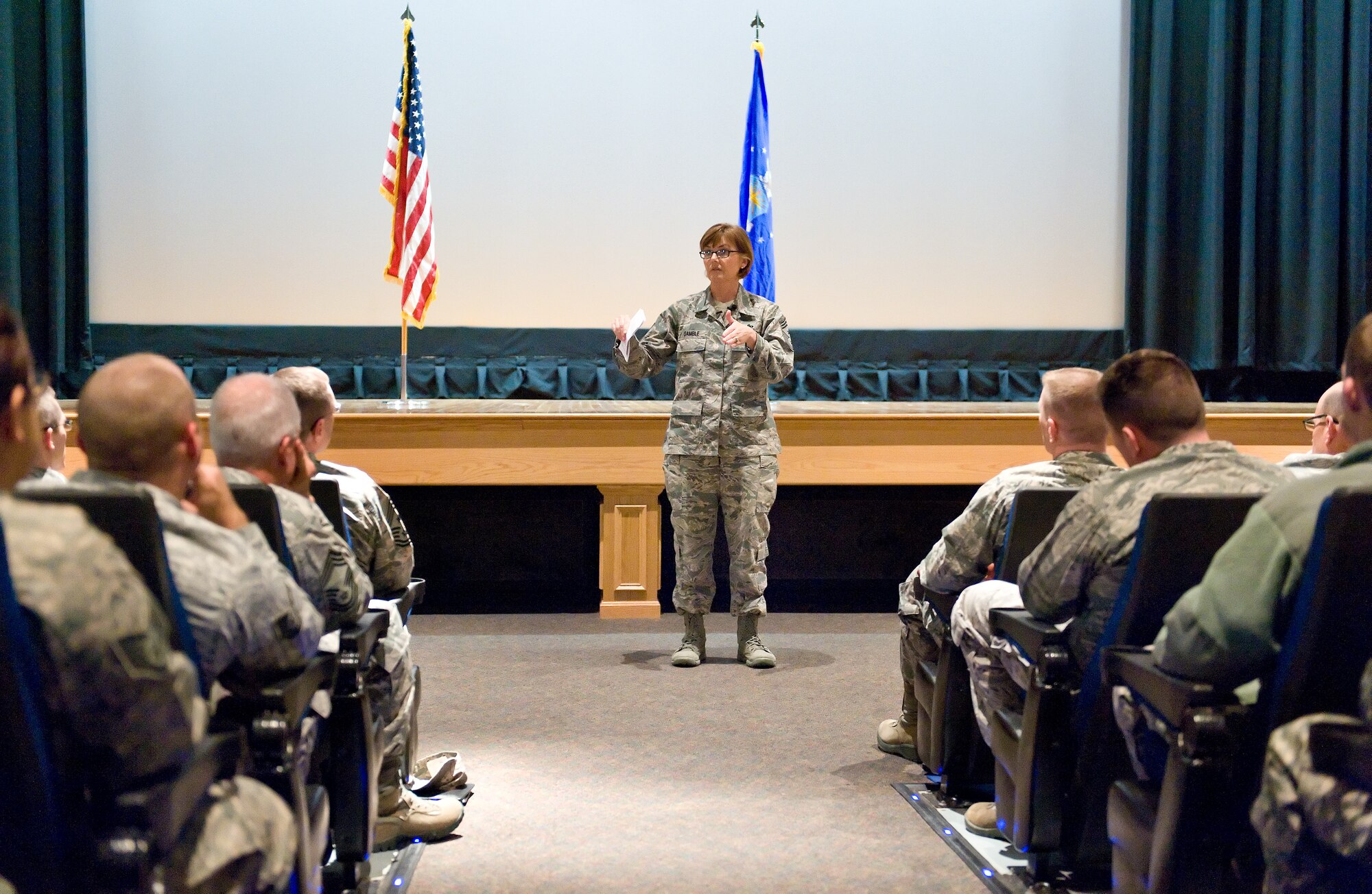 Chief Master Sgt. Victoria Gamble, Air Mobility Command chief speaks to Team Dover members Dec. 4, 2014, at the Base Theater on Dover Air Force Base, Del. Gamble spoke on a wide variety of topics during an all call and answered questions from Team Dover members in attendance. (U.S. Air Force photo/Roland Balik)
