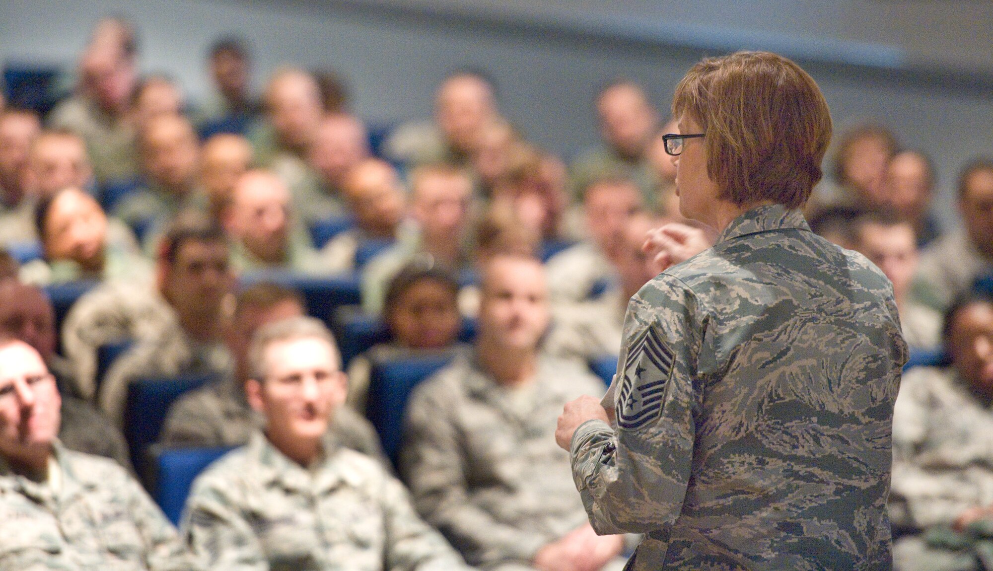 Chief Master Sgt. Victoria Gamble, Air Mobility Command chief speaks to Team Dover members Dec. 4, 2014, at the Base Theater on Dover Air Force Base, Del. Gamble held an all call at the end of her one-day visit to Dover AFB. (U.S. Air Force photo/Roland Balik)