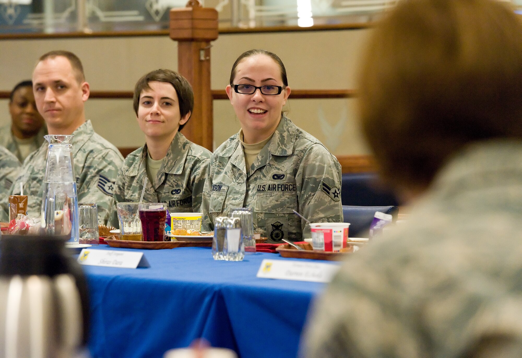 Airman 1st Class Sydnee Jackson, 436th Security Forces Squadron; Airman 1st Class Sidney Journey, 436th Maintenance Group; and Staff Sgt. Scott Tutskey, 436th Communications Squadron; right to left respectively, listen to Chief Master Sgt. Victoria Gamble, Air Mobility Command chief, right foreground, during breakfast Dec. 4, 2014, at the Patterson Dining Facility on Dover Air Force Base, Del. Gamble had breakfast with about 30 noncommissioned officers and Airmen while getting to know what they do at the base. (U.S. Air Force photo/Roland Balik)