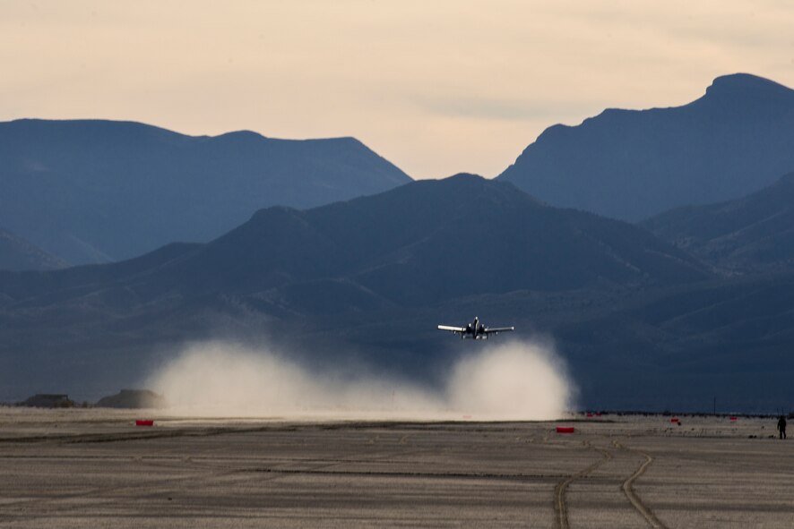 U.S. Air Force Lt. Col. Ryan Haden, 74th Fighter Squadron commander and A-10C Thunderbolt II pilot, takes off from a sand runway Dec. 3, 2014, at the White Sands Missile Range, N.M. The A-10s engine placement is designed to keep foreign objects from entering the turbines during events such as desert landings and takeoffs. (U.S. Air Force Photo by Airman 1st Class Ryan Callaghan/Released)