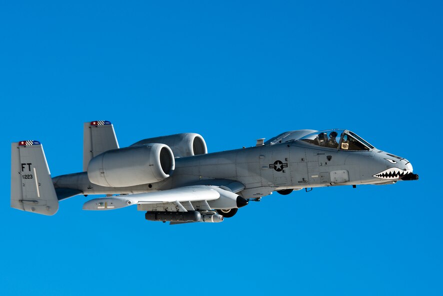 U.S. Air Force Maj. Dan Edgar, 74th Fighter Squadron A-10C Thunderbolt II pilot, flies a low-approach Dec. 3, 2014, over White Sands Missile Range, N.M. The A-10C’s primary functions include airborne forward air control, close air support and combat search and rescue. (U.S. Air Force Photo by Airman 1st Class Ryan Callaghan/Released)