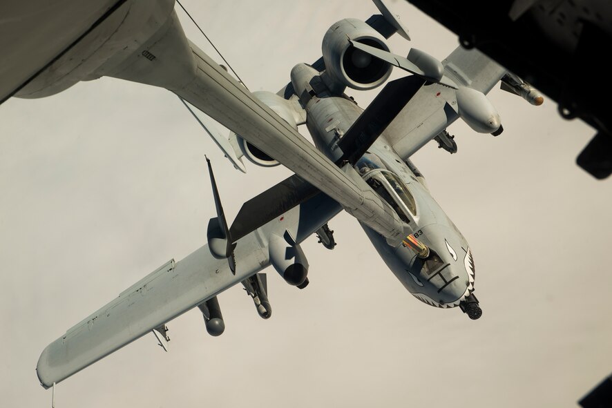 U.S. Air Force Lt. Col. Ryan Haden, 74th Fighter Squadron commander, pilots an A-10C Thunderbolt II while refueling from a KC-10 Extender, Dec. 1, 2014, in the skies over Texas. The 74th FS flew 10 A-10Cs to Fort Bliss, Texas to support the 1st Armored Division in Exercise IRON STRIKE 2014. (U.S. Air Force Photo by Airman 1st Class Ryan Callaghan/Released)