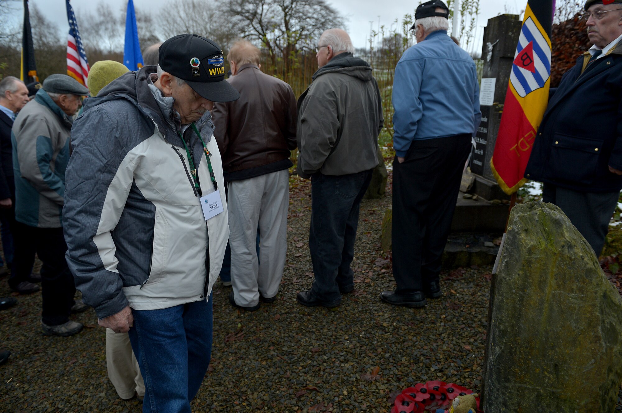 Victor Cross, World War II veteran, pays respect to 11 African American Soldiers, Dec. 10, 2014. The soldiers died outside of Wereth, Belgium, during the Battle of the Bulge. Cross visited the memorial with nearly a dozen other veterans during the 70th Anniversary of the Battle of the Bulge. (U.S. Air Force photo by Airman 1st Class Kyle Gese/Released)