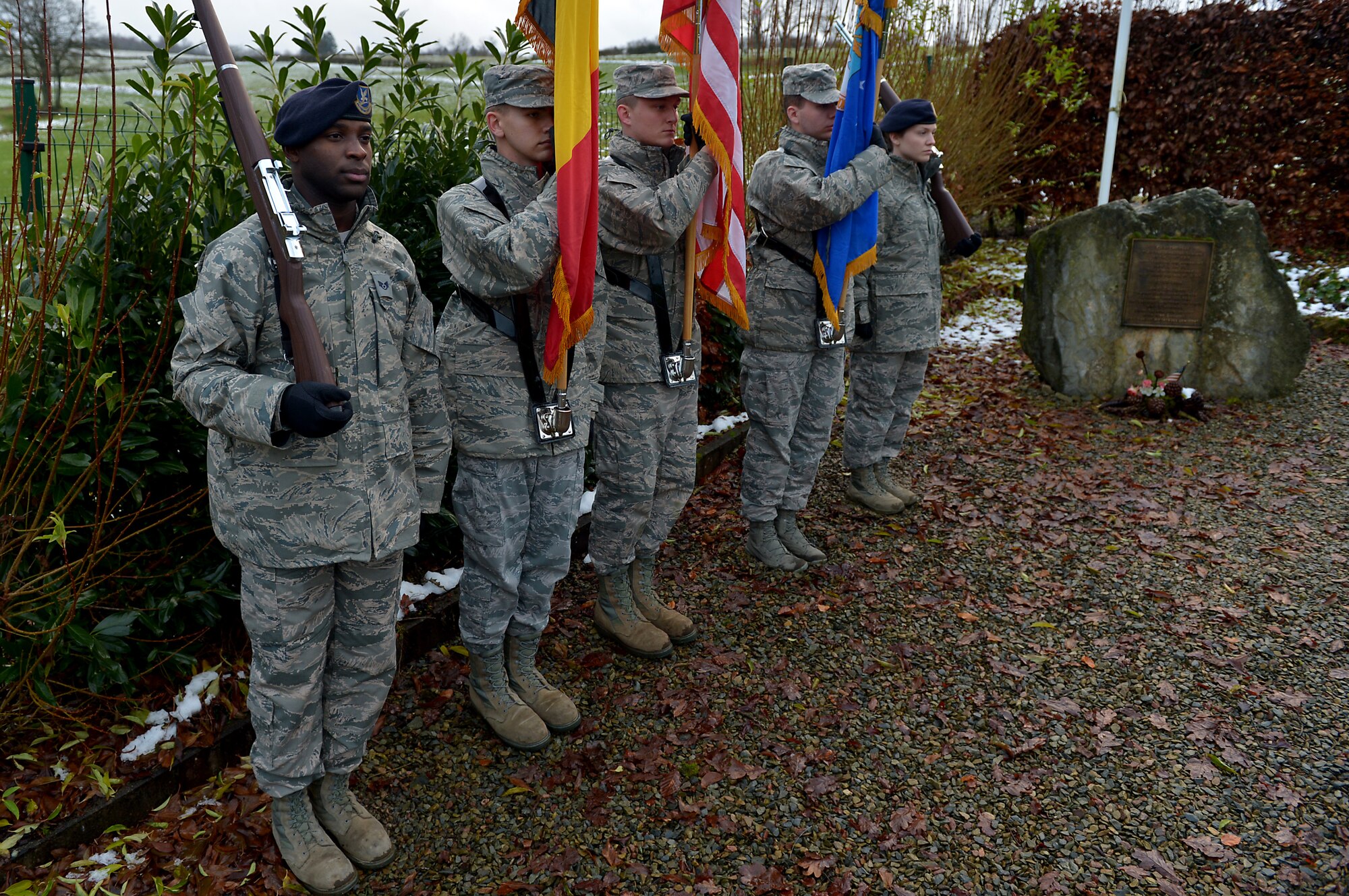 A U.S. Air Force honor guard team stands before the Wereth 11 memorial, Belgium, to pay respect to returning World War II veterans, Dec. 10, 2014. Nearly a dozen veterans returned to Europe to attend ceremonies in remembrance of the Battle of the Bulge. The veterans visited Elsenborn, Belgium, on their first day before visiting the Wereth 11 memorial. (U.S. Air Force photo by Airman 1st Class Kyle Gese/Released)