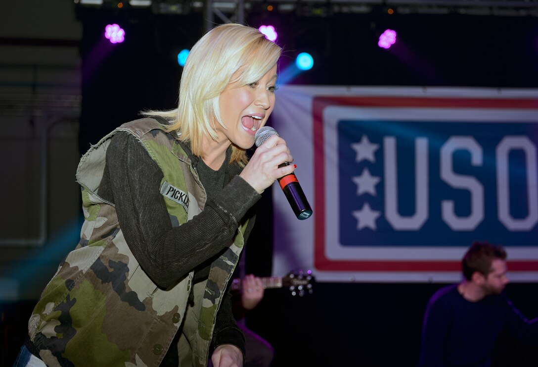 Kellie Pickler, country music artist, sings for airmen at the USO Holiday Troop Visit on Royal Air Force Mildenhall, England, Dec. 10, 2014. This was Pickler’s eighth USO tour. 