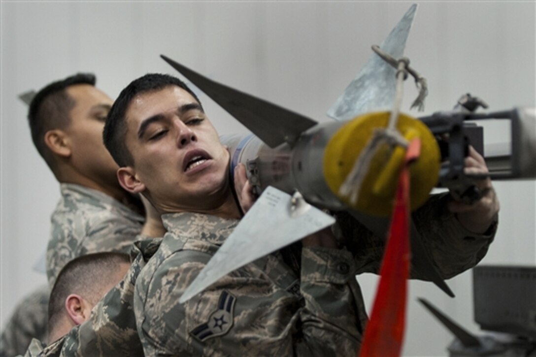 Air Force Airman 1st Class Austin Cooper competes in the Load Crew of the Year competition on Eielson Air Force Base, Alaska, Dec. 5, 2014. Cooper is a weapons loader assigned to the 354th Maintenance Squadron. 