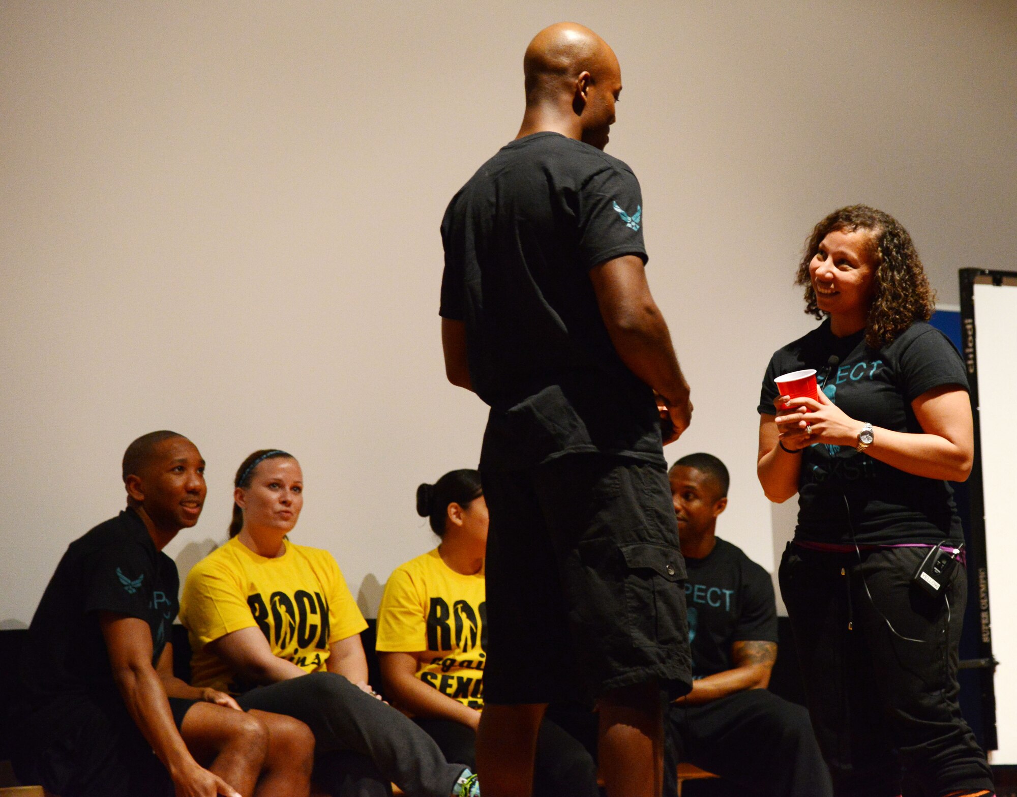 SOUTHWEST ASIA - Senior Airman Jarret Ware, and Staff Sgt. Ashley Gonzales perform a skit as part of a performance put on by the 386th Air Expeditionary Wing's Sexual Assault Prevention and Response Team here Dec. 9, 2014. The performance featured five skits related to sexual assault and harassment and eight vocal and poetry performances. (U.S. Air Force photo by Tech. Sgt. Jared Marquis/released)

