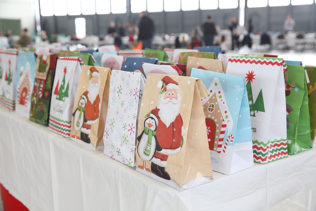 Leaders with Headquarters and Headquarters Squadron and Marine Transport Squadron 1 hosted breakfast with Santa at Marine Corps Air Station Cherry Point, N.C., Dec. 6, 2014. VMR-1 Marines transported Santa from the North Pole to Cherry Point where he passed out presents and heard Christmas requests from the children of more than 25 families who attended. H&HS and VMR-1 hosted the event to bring together family members and spread holiday cheer throughout the two squadrons.  