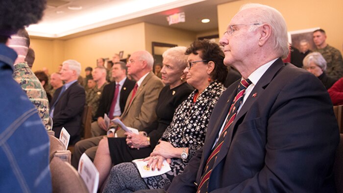 Marine Vietnam veterans and their spouses listen intently to speakers at the Lt. Vincent Capodanno Medal of Honor Dedication at the Capodanno Chapel aboard The Basic School, Marine Corps Base Quantico, Virginia, December 9, 2014. Capodanno served as a Navy chaplain with 3rd Battalion, 5th Marine Regiment during the Vietnam War and was posthumously awarded the Medal of Honor for his actions. Capodanno's Medal of Honor was recently donated to the chapel and was dedicated during the ceremony.