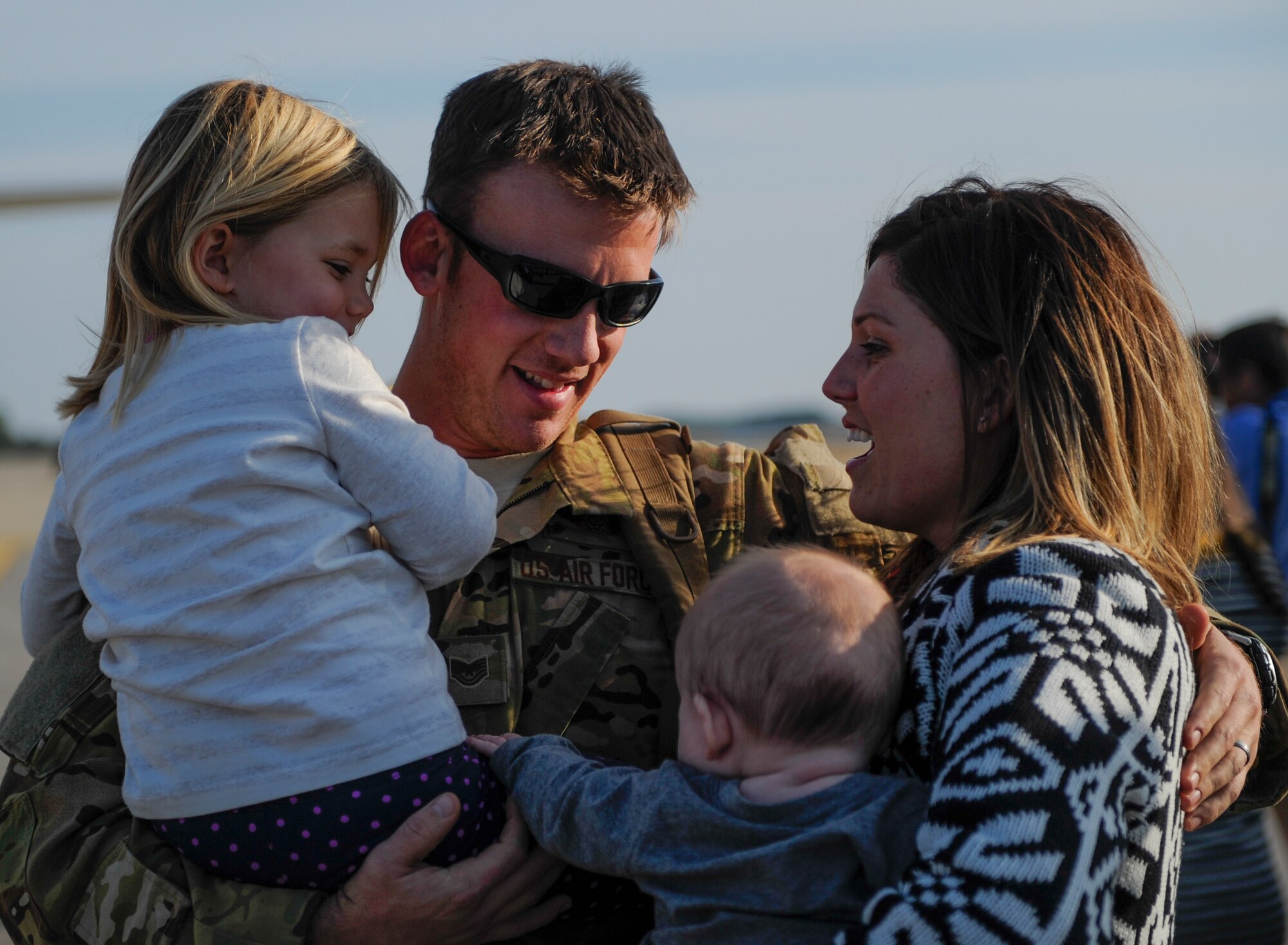 Tech. Sgt. Jeff Hieber, 4thSpecial Operations Squadron sensor operator, hugs his family during Operation Homecoming Dec. 11, 2014, after returning to Hurlburt Field, Fla. from a deployment. Operation Homecoming welcomed home more than 40 Air Commandos. (U.S. Air Force photo/Senior Airman Christopher Callaway).