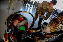 Remy Hieber, reaches for his father, Tech Sgt. Jeff Hieber, 4th Special Operations Squadron sensor operator, on Hurlburt Field, Fla., Dec. 11, 2014. Heiber recently returned from a deployment along with more than 40 other Air Commandos. (U.S. Air Force photo/Senior Airman Christopher Callaway) 