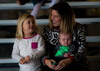 Elliot and Erin Hieber talk while waiting for Tech. Sgt. Jeff Hieber, 4th Special Operations Squadron sensor operator, to return from deployment at Hurlburt Field, Fla., during Operation Homecoming Dec. 11, 2014. More than 40 Air Commandos returned home. (U.S Air Force photo/Senior Airman Christopher Callaway)