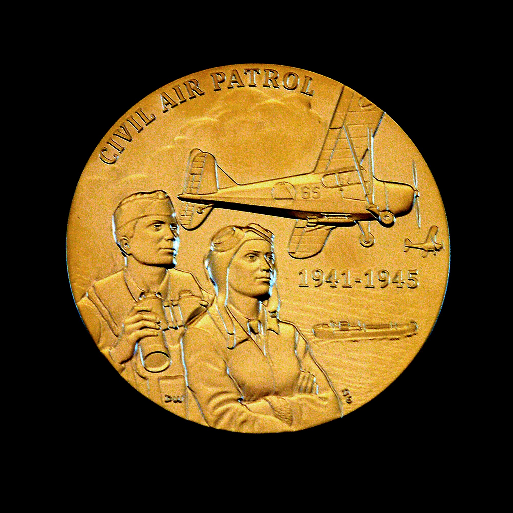 A close up of the Congressional Gold Medal presented by Speaker of the House of Representatives John Boehner to the Civil Air Patrol in honor of the World War II members during a ceremony Dec. 10, 2014 on Capitol Hill, Washington, D.C.  (U.S. Air Force/Andy Morataya)