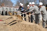 Connecticut Gov. M. Jodi Rell falls in with the troops of the 103rd Maintenance Squadron's Centralized Intermediate Repair Facility for a photo opportunity after throwing the first shovelful of dirt during a groundbreaking ceremony March 6, 2010. The new facility will boost work and training space to roughly 30,000 square feet and will house about 80 technicians, who will work on the engines for Air National Guard and active-duty A-10s.