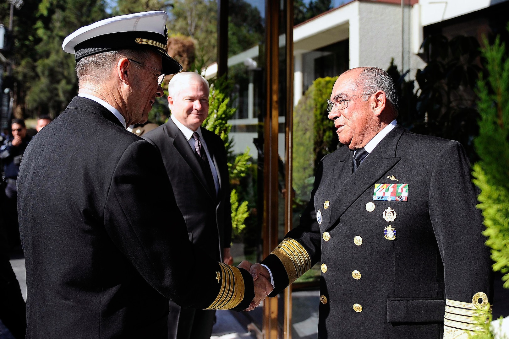 U.S. Defense Secretary Robert M. Gates and Adm. Mike Mullen, chairman of the Joint Chiefs of Staff, greet Mexico's Secretary of the Navy Adm. Mariano Francisco Saynez during a visit in Mexico City, March 23, 2010