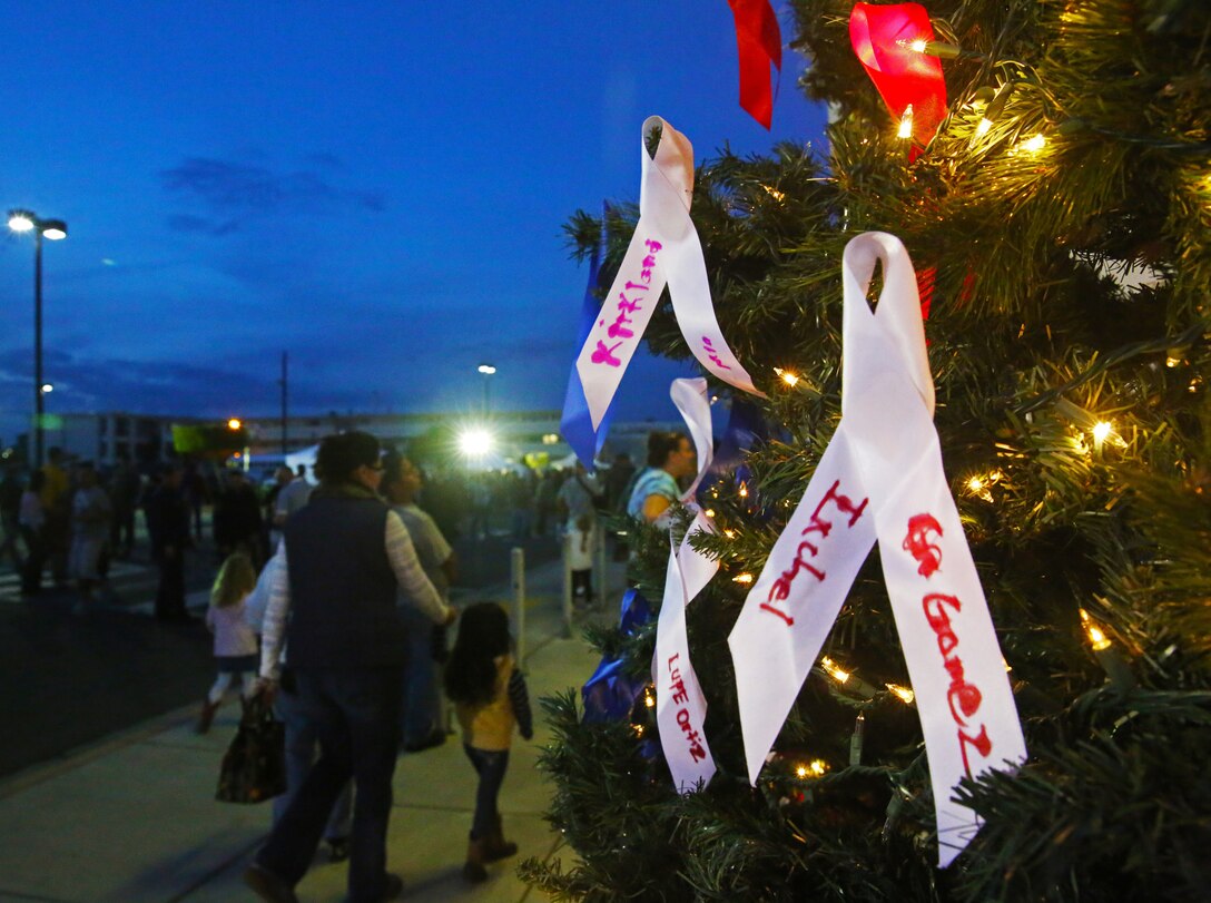 In the spirit of the holidays, Marine Corps Community Services hosted the annual All Wrapped Up event at Marine Corps Air Station Yuma, Ariz., Friday, Dec. 5, 2014. Service members and their families took part in the tree lighting ceremony, free food samples, live music and prize raffles.