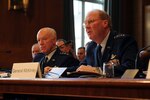 U.S. Sen. Christopher "Kit" Bond talks with Air Force Lt. Gen. Harry M. Wyatt III, director of the Air National Guard, before a hearing of the Senate Appropriations Subcommittee on Defense in Washington, D.C., March 24, 2010.