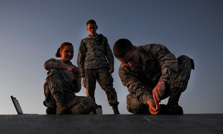 Airmen from the 1st Special Operations Maintenance Group work on the wing of an MC-130H Talon II at Hurlburt Field, Fla., Dec. 8, 2014. The 1st SOMXG provides support to more than 70 aircraft assigned to the 1st Special Operations Wing. (U.S. Air Force photo/Senior Airman Christopher Callaway)