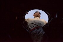 Staff Sgt. Aljhaun Bordenave, 15th Aircraft Maintenance Unit hydraulics technician, climbs out of the MC-130 Talon II to perform inspections at Hurlburt Field, Fla., Dec. 8, 2014. The Combat Talon II is capable of penetrating a hostile environment at altitudes and in inclement weather. (U.S. Air Force photo/Senior Airman Meagan K. Schutter)