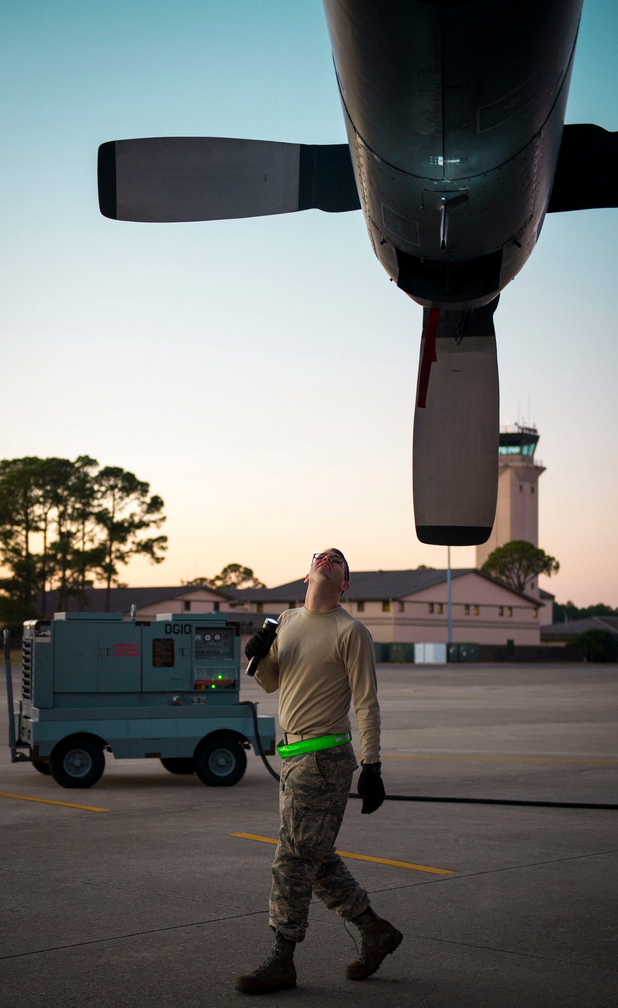 An Airman from the 15th Aircraft Maintenance Unit, inspects a MC-130 Talon II at Hurlburt Field, Fla., Dec. 8, 2014. The Combat Talon II is a derivative of the C-130 Hercules modified for special operations. (U.S. Air Force photo/Senior Airman Meagan K. Schutter)