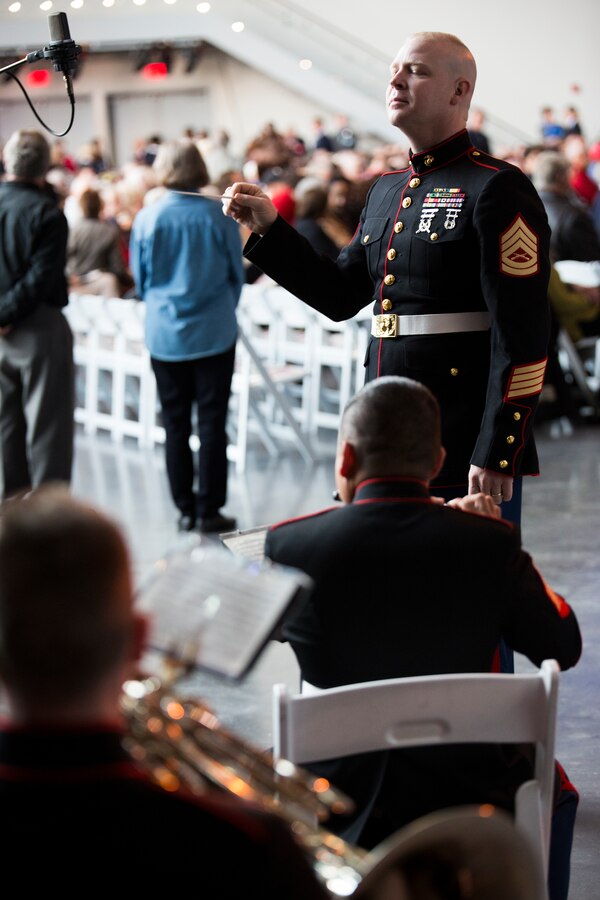 Gunnery Sgt. Michael Maschmeier, the enlisted conductor of Marine Corps Band New Orleans, conducts the band during a ceremony at the National World War II Museum in New Orleans, Dec. 12, 2014. The ceremony marked the museum’s newest exhibit, “The Road to Berlin,” which commemorates the path that led to D-Day and the fierce battles that followed. 