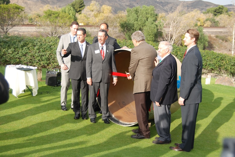 David Van Dorpe, (right) deputy district engineer for programs and project management for the U.S. Army Corps of Engineers Los Angeles District, joins elected official and agency representatives for the ceremonial ribbon cutting marking the completion of the project to relocate the Santa Ana River Interceptor Line from below the river to higher ground outside the river's path.