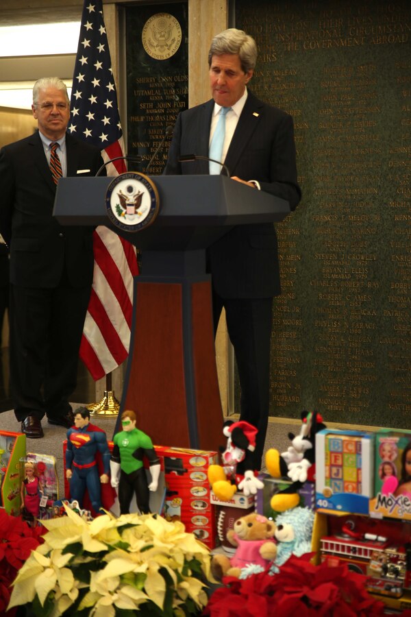 Secretary of State John Kerry delivers a speech about the importance of Toys for Tots during a Toy for Tots event held at the U.S. State Department building, Dec. 9, 2014. Toys for Tots is a Marine Corps Reserve sponsored foundation dedicated to providing under privileged children with toys for Christmas.  