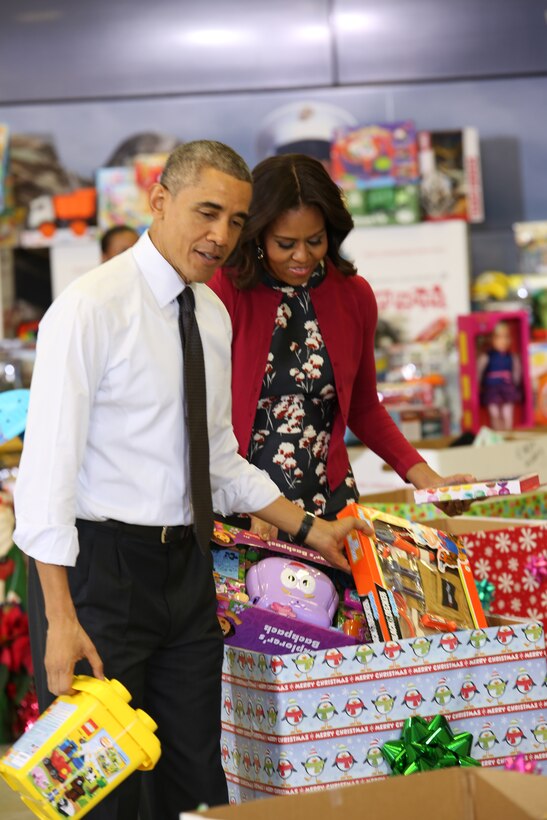 President Barack Obama and First Lady Michelle Obama sort toys during a Toys for Tots event at Joint Base Anacostia-Bolling, Dec. 10, 2014. The president and first lady are avid donators and spokespeople for the Toys for Tots program, a program developed by Marine Forces Reserve to provide needy children with toys for Christmas. 