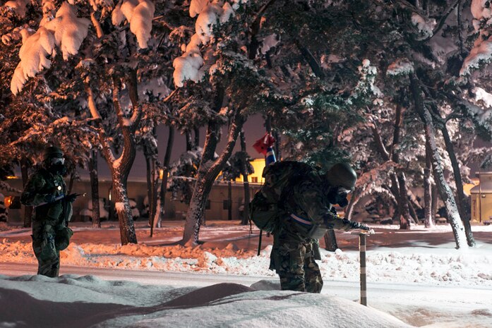 KUNSAN AIR BASE, Republic of Korea (Dec 8, 2014) - U.S. Air Force Airmen from the 8th Comptroller Squadron conduct a post attack reconnaissance sweep after a simulated ground attack during Exercise Beverly Bulldog 15-1. The eight-day exercise took place in an austere environment that tested the Wolf Pack’s ability to respond to wartime and armistice conditions. (U.S. Air Force photo by Senior Airman Katrina Heikkinen) 141206-F-ES731-038

