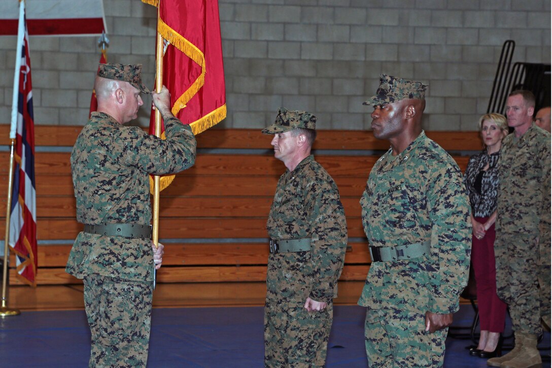 U.S. Marines and Sailors with 13th Marine Expeditionary Unit (13th MEU) conduct a Change of Command ceremony at the 21 Area fitness center aboard Camp Pendleton, Calif., Dec. 12, 2014. During the Change of Command ceremony, LtCol. Joseph Lagoski relinquished command of the 13th MEU to Col. Anthony Henderson. (U.S. Marine Corps photo by Cpl. David Gonzalez, 13th Marine Expeditionary Combat Camera/ Released)