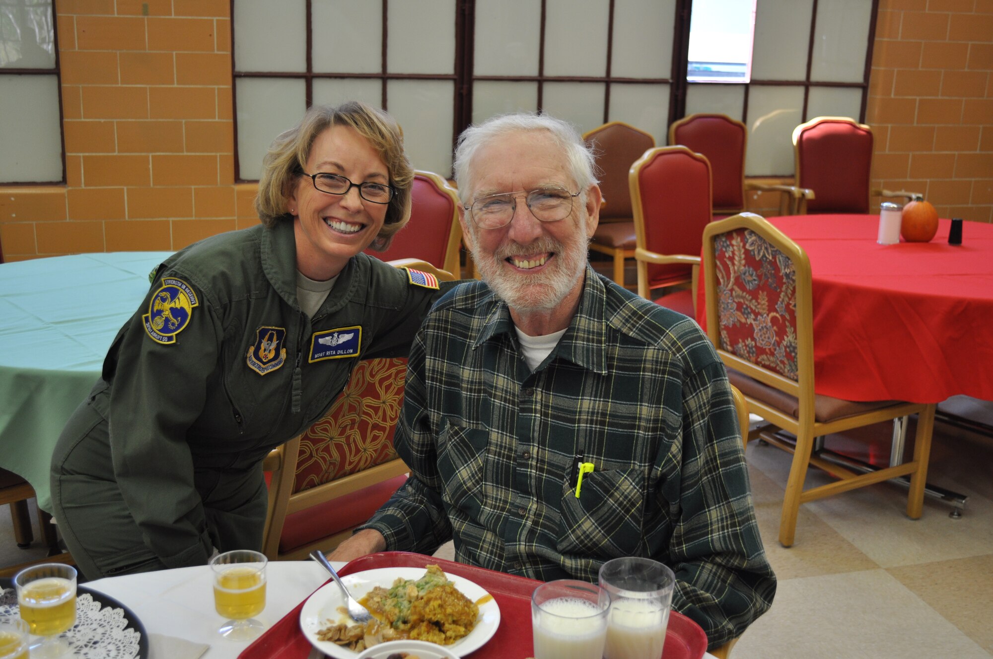 TRAVIS AIR FORCE BASE, Calif. -- Airmen from the 349th Air Mobility Wing "Give Thanks' by serving dinner to these veterans who have paved the way for the military we have today. Along with their friends and family, they share fellowship and a scrumptious turkey dinner with the men and women who, happily, shared their military stories and experiences. (U.S. Air Force photo / Ellen Hatfield) 