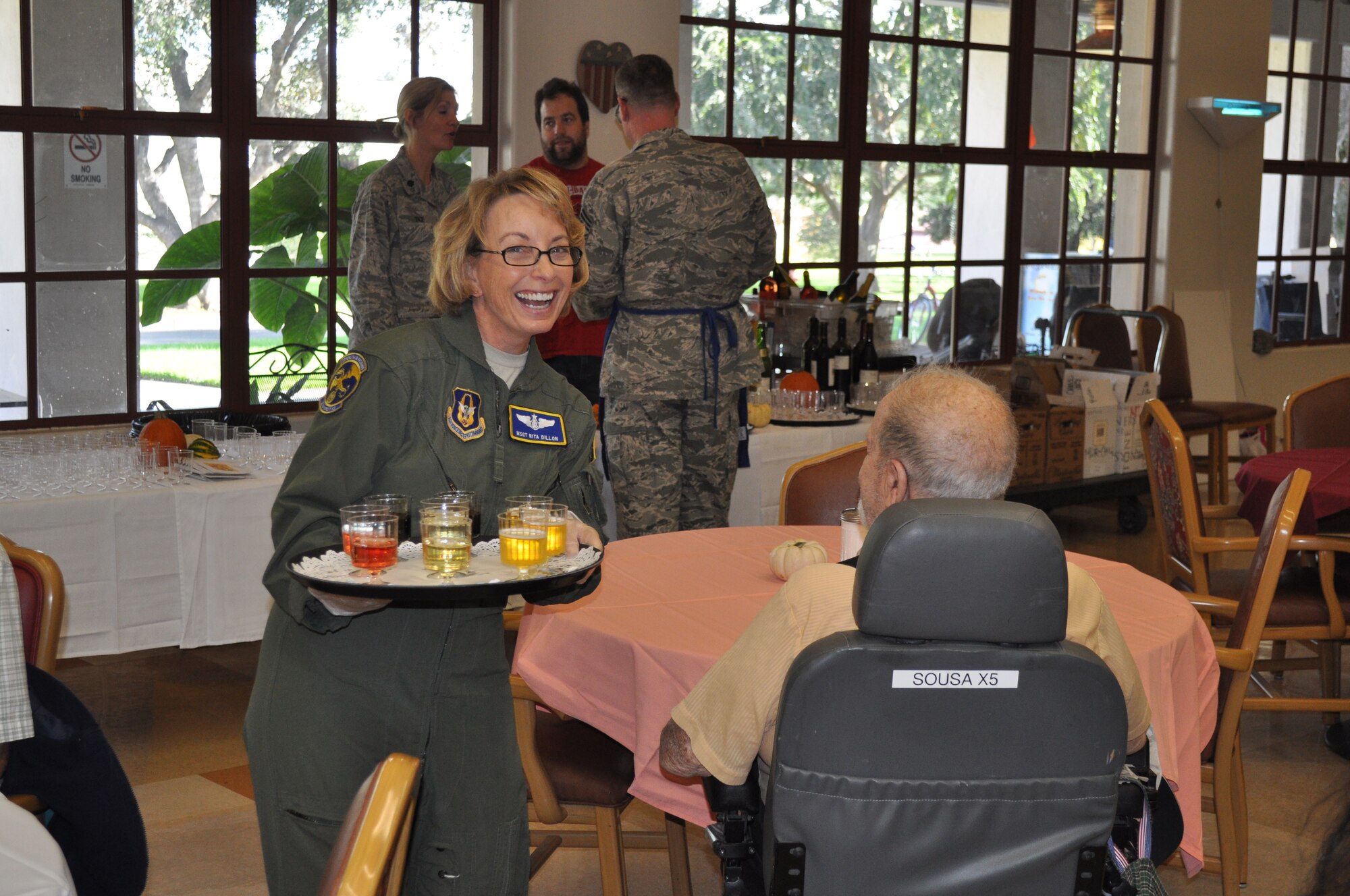 TRAVIS AIR FORCE BASE, Calif. -- Airmen from the 349th Air Mobility Wing "Give Thanks' by serving dinner to these veterans who have paved the way for the military we have today. Along with their friends and family, they share fellowship and a scrumptious turkey dinner with the men and women who, happily, shared their military stories and experiences. (U.S. Air Force photo / Ellen Hatfield) 