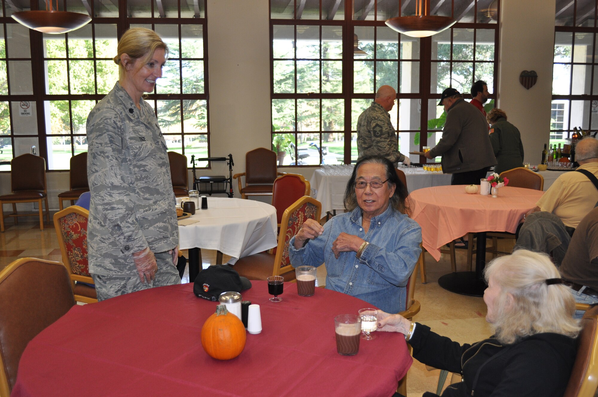 TRAVIS AIR FORCE BASE, Calif. -- Airmen from the 349th Air Mobility Wing "Give Thanks' by serving dinner to these veterans who have paved the way for the military we have today. Along with their friends and family, they share fellowship and a scrumptious turkey dinner with the men and women who, happily, shared their military stories and experiences. (U.S. Air Force photo / Ellen Hatfield) 