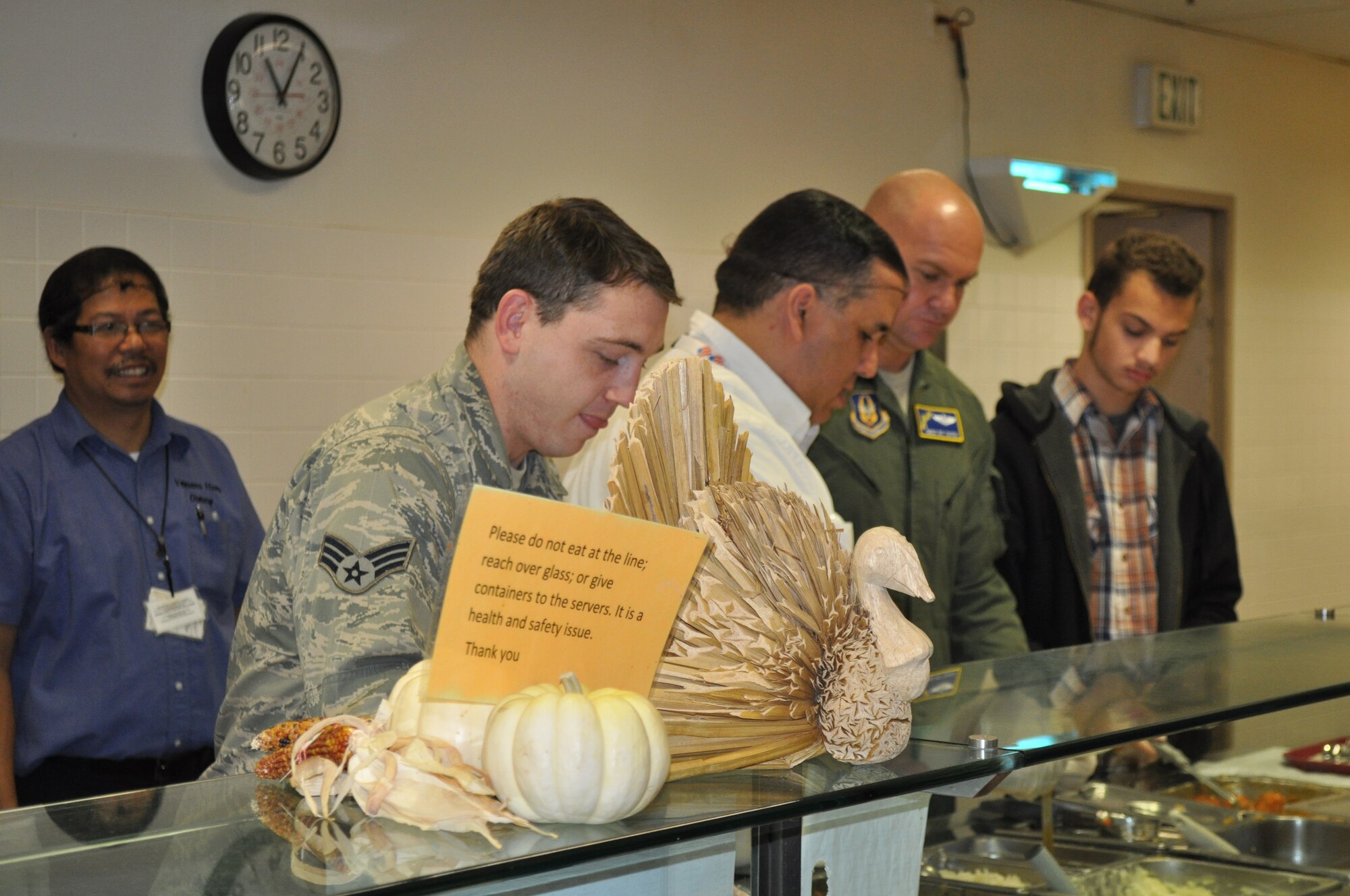 TRAVIS AIR FORCE BASE, Calif. -- Airmen from the 349th Air Mobility Wing "Give Thanks' by serving dinner to these veterans who have paved the way for the military we have today. Along with their friends and family, they share fellowship and a scrumptious turkey dinner with the men and women who, happily, shared their military stories and experiences. (U.S. Air Force photo / Ellen Hatfield) 