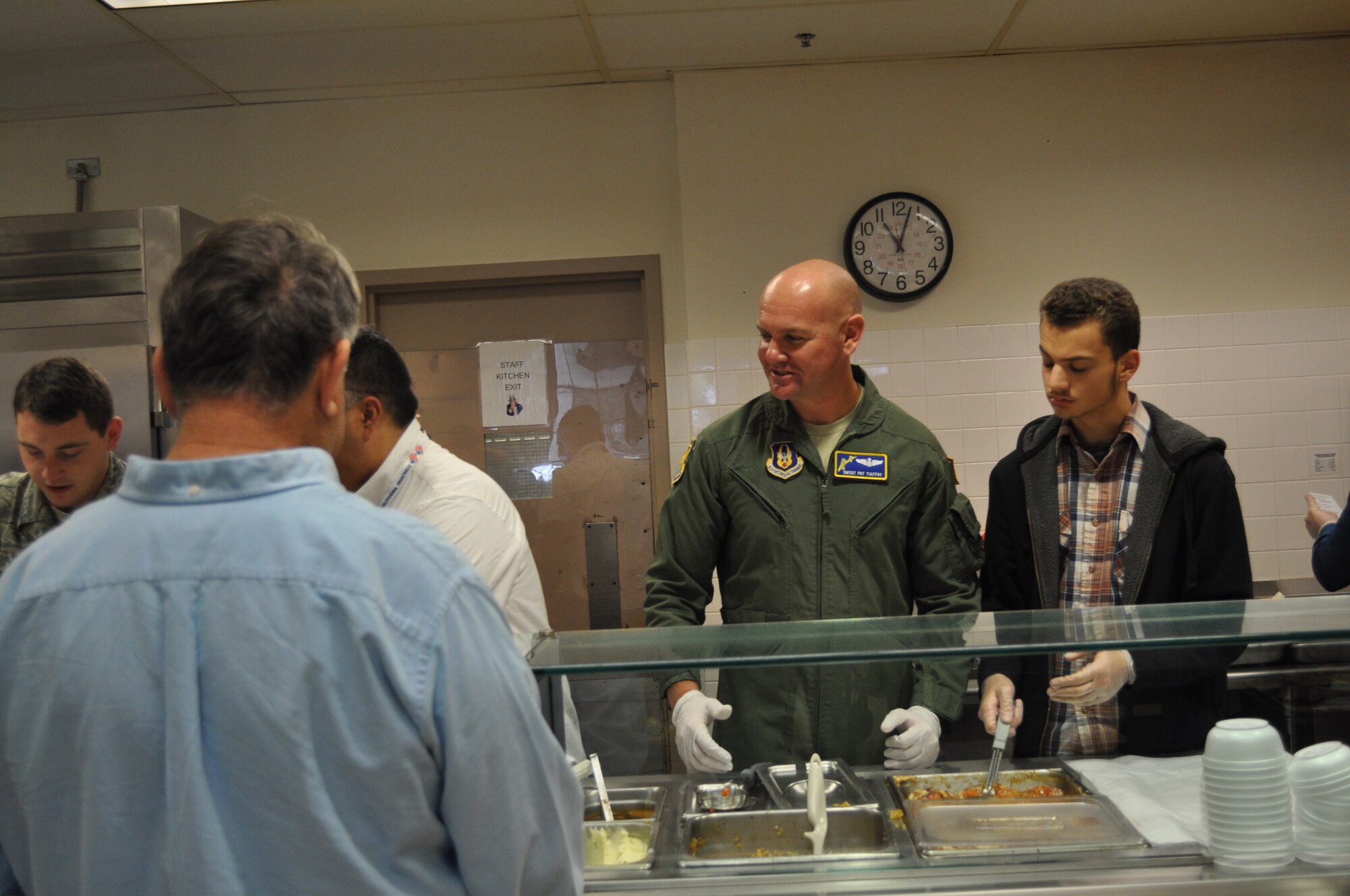 TRAVIS AIR FORCE BASE, Calif. -- Airmen from the 349th Air Mobility Wing "Give Thanks' by serving dinner to these veterans who have paved the way for the military we have today. Along with their friends and family, they share fellowship and a scrumptious turkey dinner with the men and women who, happily, shared their military stories and experiences. (U.S. Air Force photo / Ellen Hatfield) 