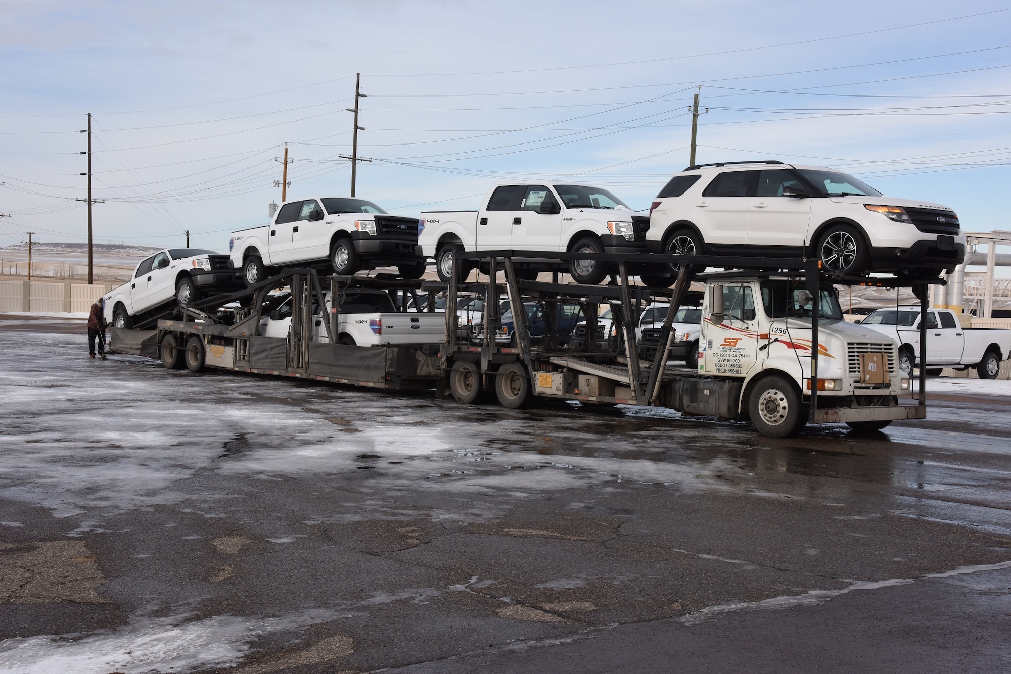 New vehicles are delivered to Malmstrom Air Force Base’s vehicle maintenance bay Nov. 18. Malmstrom Air Force Base is receiving 43 new vehicles for members deploying to the missile field through the Force Improvement Program. (U.S. Air Force photo/Airman 1st Class Collin Schmidt)