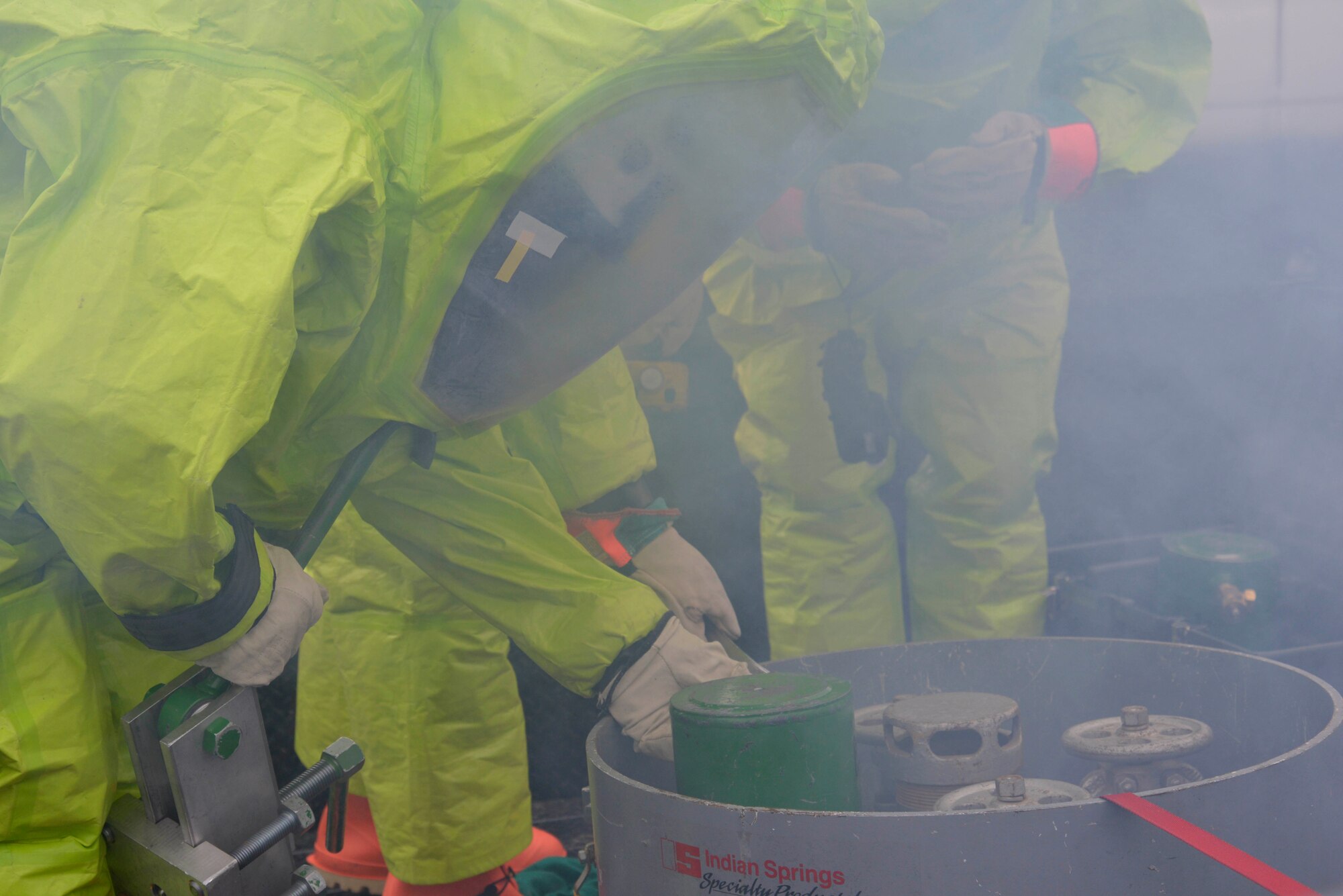 A Fairchild firefighter treats a victim during a hazardous materials emergency response exercise Dec. 10, 2014, at Fairchild Air Force Base, Wash. The HAZMAT teams, bioenvironmental team and Fairchild medical technicians were part of the four day exercise. (U.S. Air Force photo/Senior Airman Janelle Patiño)
