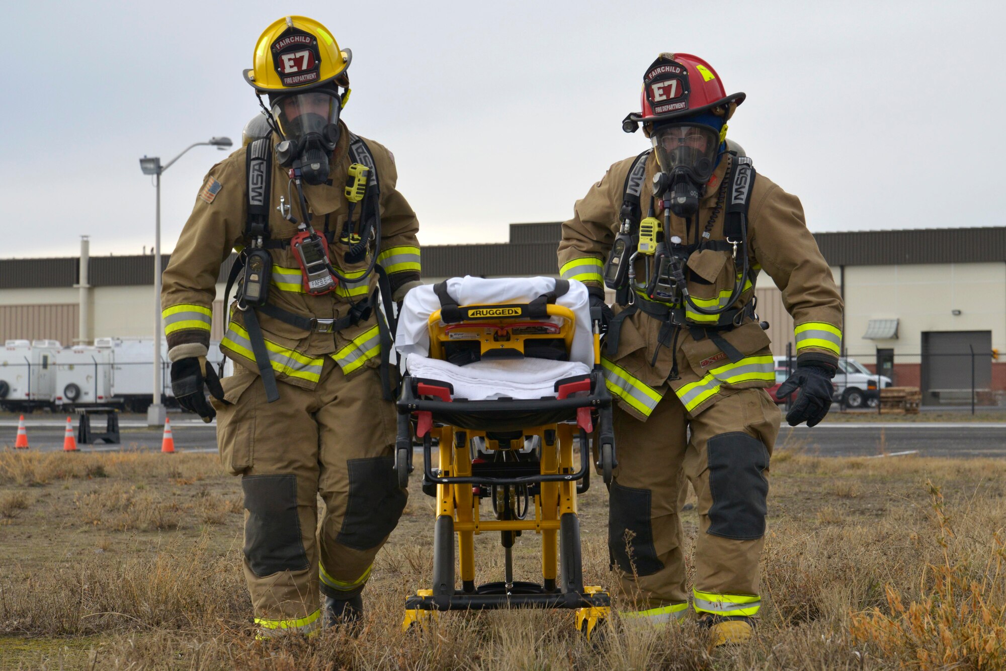 Fairchild firefighters rescue a victim from the scene during a hazardous materials emergency response exercise Dec. 10, 2014, at Fairchild Air Force Base, Wash. The four day exercise consisted of 40-60 members from Fairchild and Local Spokane, Wash. agencies. (U.S. Air Force photo/Senior Airman Janelle Patiño)