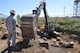 Senior Master Sgt. Robert Montgomery, heavy equipment superintendent, 163rd Civil Engineer Squadron, California Air National Guard, March Air Reserve Base, operates an excavator to move large rocks on the Heacock Channel project, Sept. 11, 2014. Reservists and Guardsmen from March participated in a joint-construction project to repair the erosion damage and sediment accumulation to the Heacock Channel on the east side of base. (U.S. Air Force photo/Senior Airman Russell S. McMillan)