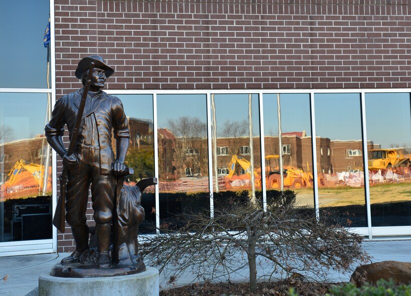 McGHEE TYSON AIR NATIONAL GUARD BASE, Tenn. - The Minuteman statue outside Patriot Hall patiently oversees construction of the new multi-use facility at the I.G. Brown Training and Education Center here Dec.12, 2014. (U.S. Air National Guard photo by Master Sgt. Jerry Harlan/Released)
