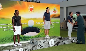 USAF Maj. Linda Jeffery (center) and Navy LT Nicole Johnson (receiving her medal) win gold and bronze respectively. The US Men and Women Armed Forces Golf teams won respective gold medals for the seventh time during the 8th CISM World Military Golf Championship held in Bahrain 13-21 November 2014. 