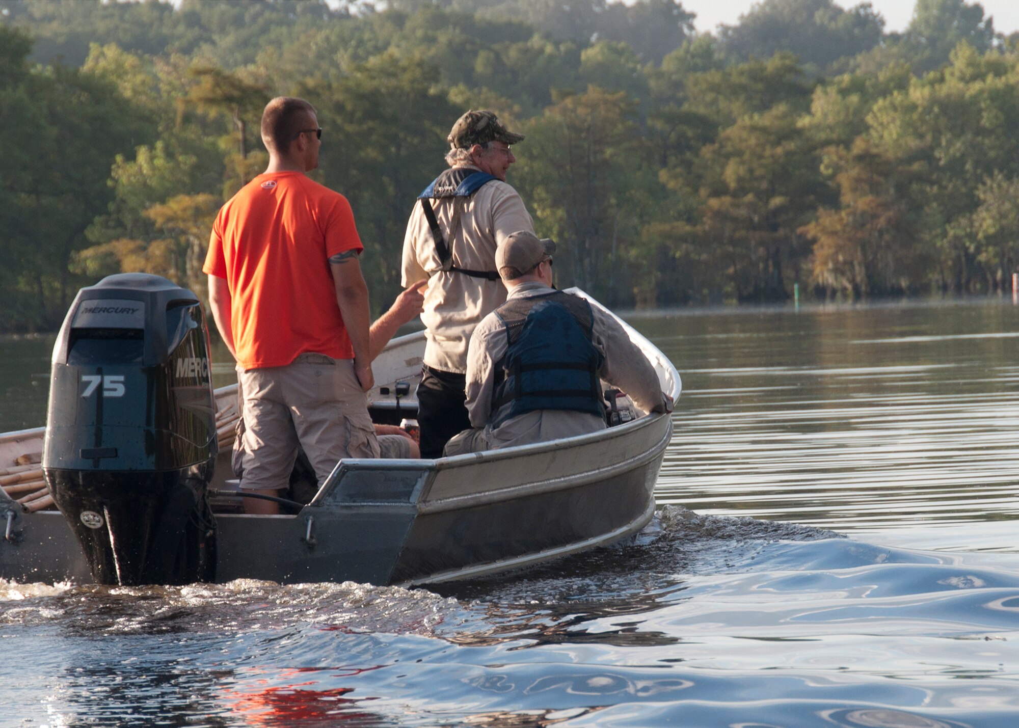 Alligator hunters and their guide navigate the waterways of Chicot State Park during an alligator in Ville Platt, La., Sept. 3, 2014.   The hunters took part in the special hunt set up through the Wounded War Heroes of Louisiana.   Only forty alligators can be taken from these waters each year through a special permit from the Louisiana Department of Wildlife and Fisheries. (U.S. Air Force photo by Tech. Sgt. Ted Daigle/Released)