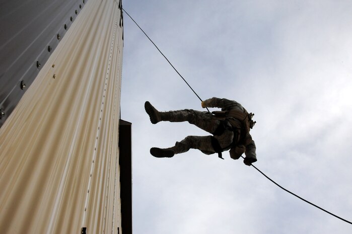 Members from the 341st Security Forces Group Tactical Response Force rappel during a training exercise Dec. 10 at Malmstrom Air Force Base. TRF members begin their training as assaulters and go on to acquire one of two additional skill sets in the fields of breaching systems or nuclear advanced designated marksmen, commonly referred to as snipers. (U.S. Air Force photo/ 2nd Lt. Annabel Monroe)  