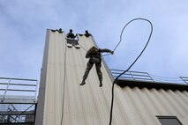 Members from the 341st Security Forces Group Tactical Response Force rappel during a training exercise Dec. 10 at Malmstrom Air Force Base. TRF members begin their training as assaulters and go on to acquire one of two additional skill sets in the fields of breaching systems or nuclear advanced designated marksmen, commonly referred to as snipers. (U.S. Air Force photo/ 2nd Lt. Annabel Monroe)  