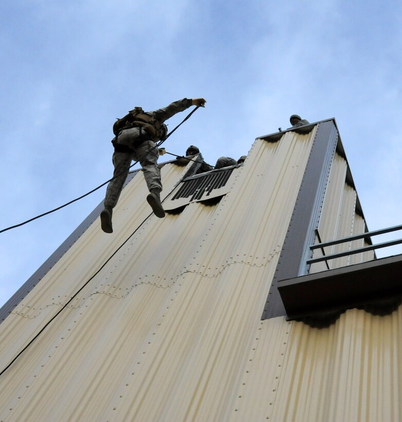 Members from the 341st Security Forces Group Tactical Response Force rappel during a training exercise Dec. 10 at Malmstrom Air Force Base. TRF members begin their training as assaulters and go on to acquire one of two additional skill sets in the fields of breaching systems or nuclear advanced designated marksmen, commonly referred to as snipers. (U.S. Air Force photo/ 2nd Lt. Annabel Monroe)  