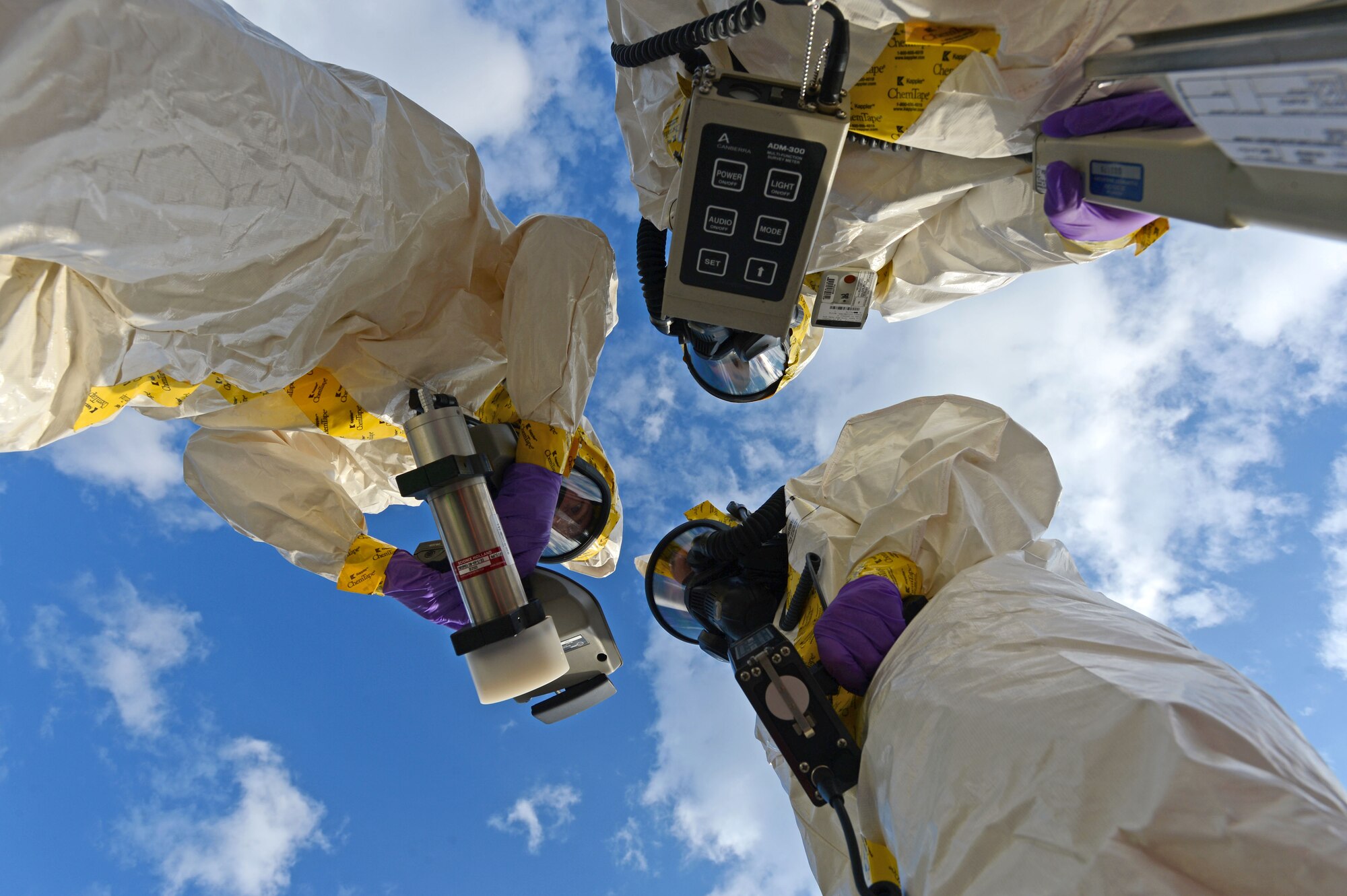 U.S. Air Force Airmen assigned to the 20th Civil Engineer Squadron, participate in an integrated base emergency response capability training exercise at Shaw Air Force Base, S.C., Dec. 9, 2014.  The three Airmen were the initial entry team and entered the simulated contaminated area to test for hazardous material. (U.S. Air Force photo by Airman 1st Class Jensen Stidham/Released) 
